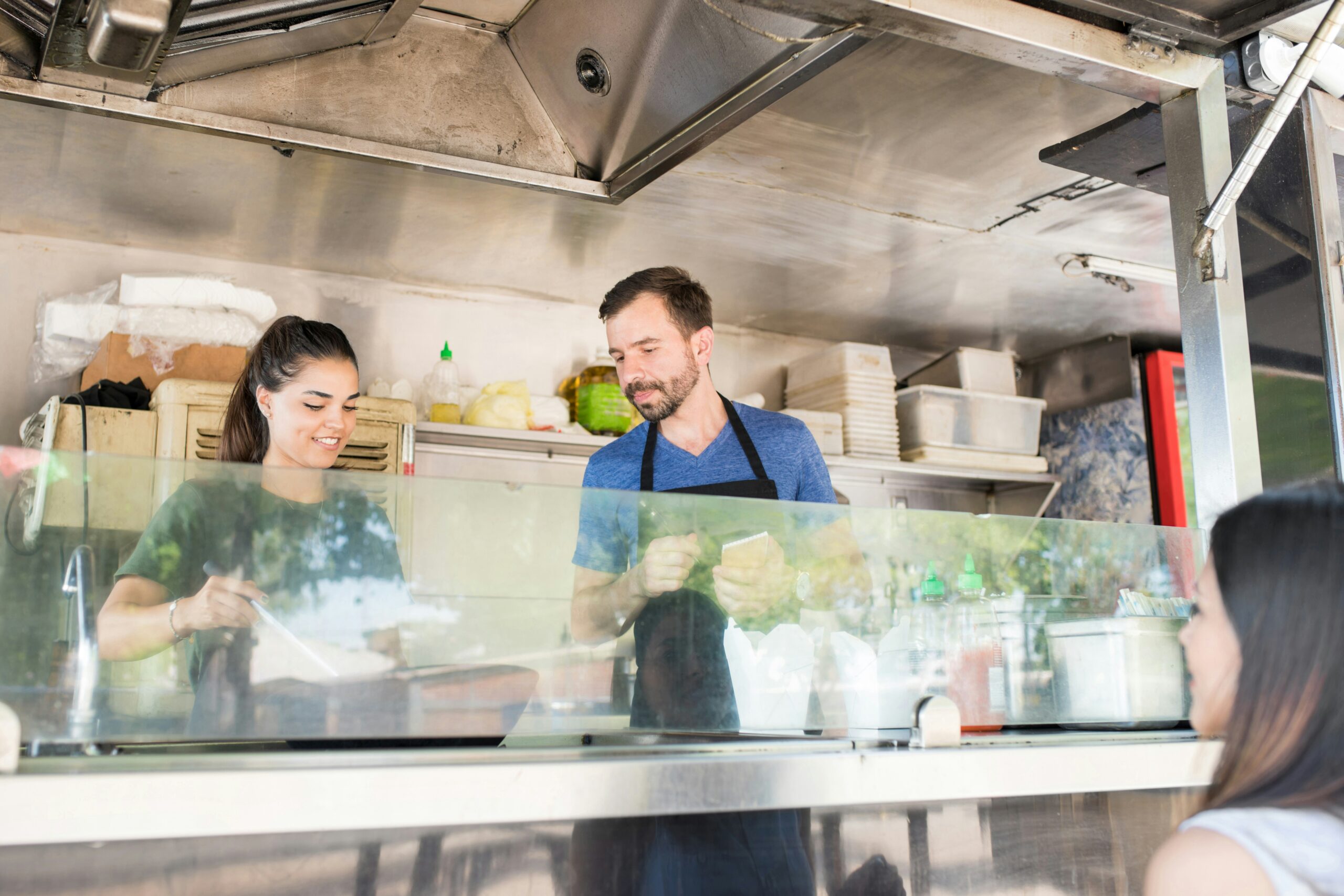 how much does it cost to start a food truck - two employees in a food truck