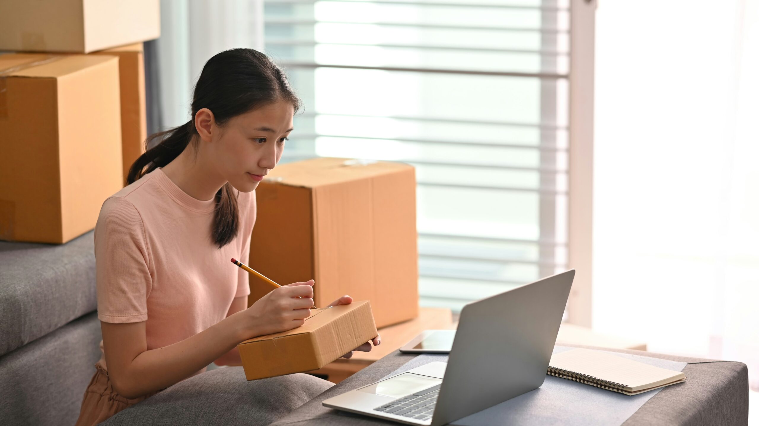 how to start a business in indiana - woman holding a pencil