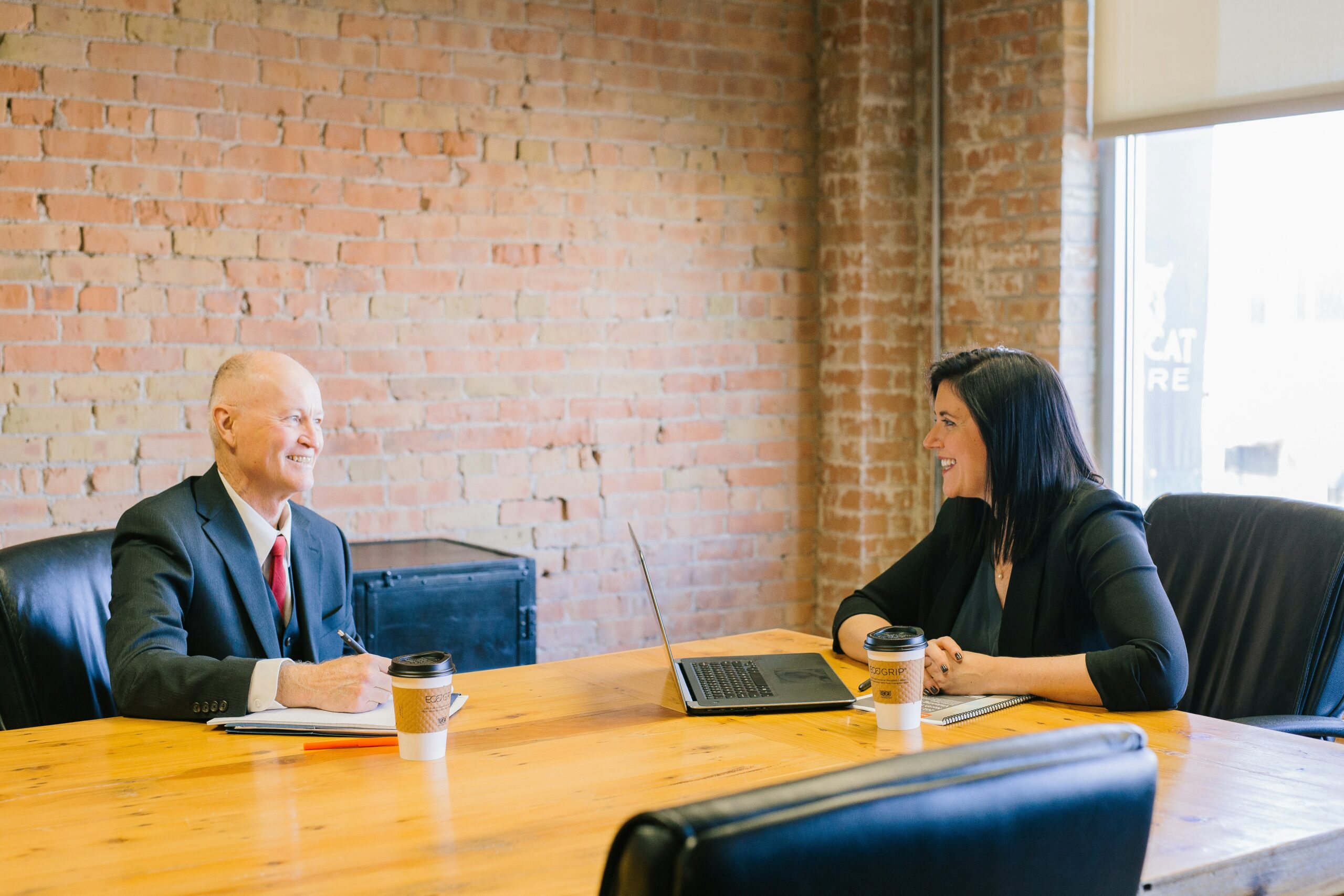 how to start a business in tennessee - business partners smiling at each other