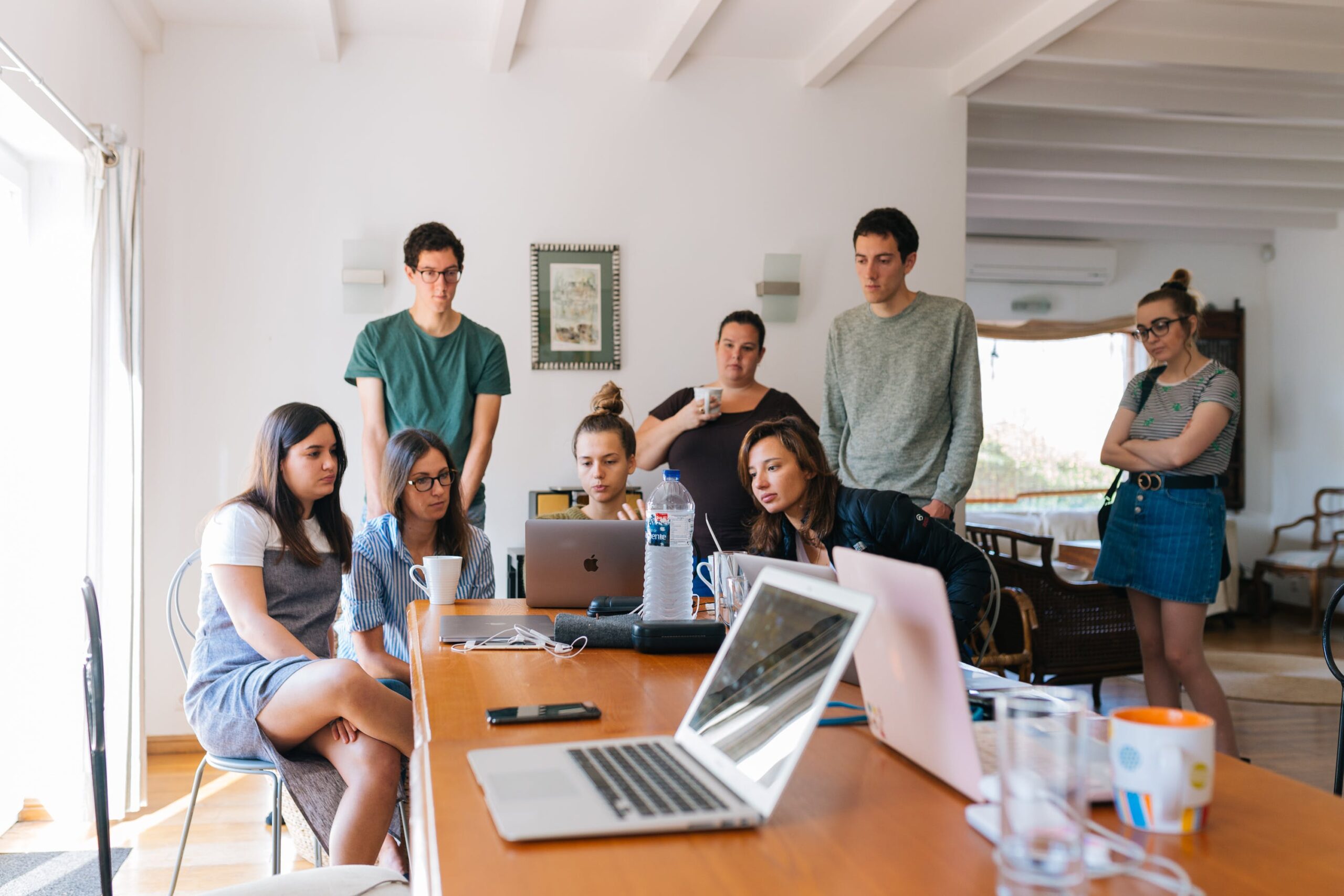 Group of people watching laptop