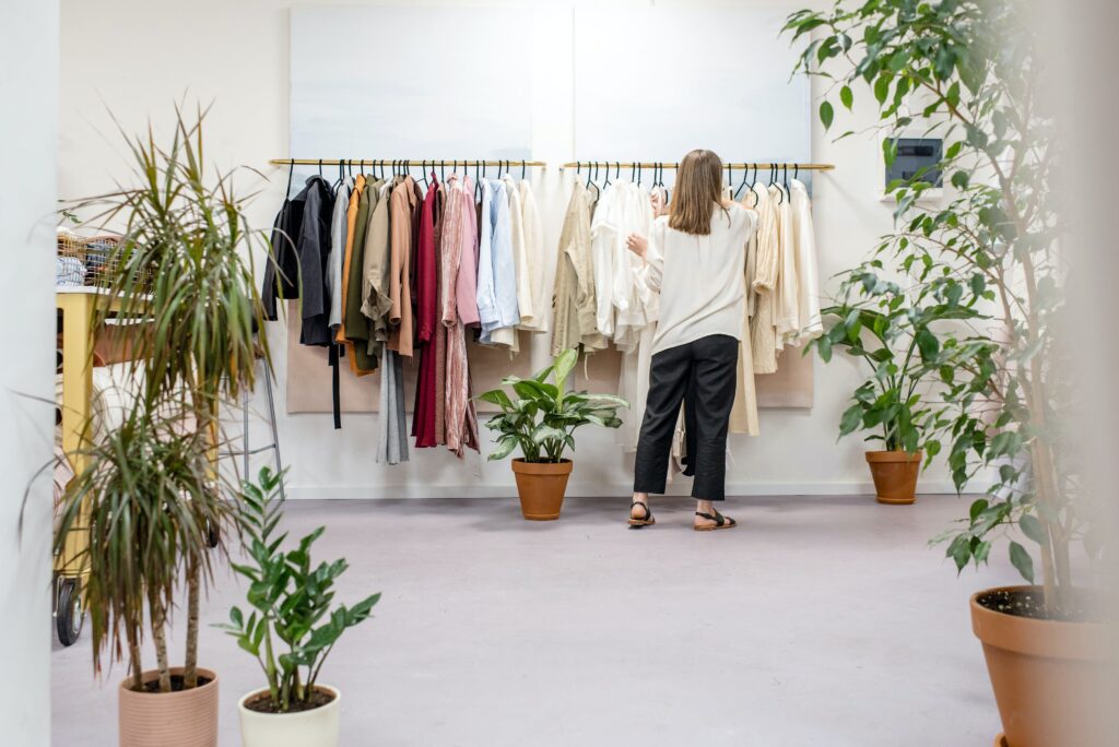 Woman organizing a clothing rack